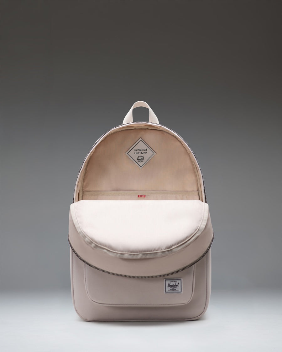 Herschel Supply Co. Settlement Backpack in Moonbeam, a classic everyday backpack in a light cream beige color.