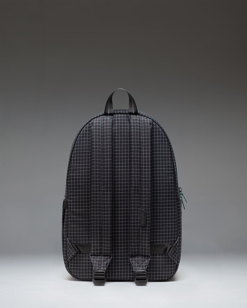 Herschel Supply Co. Settlement Backpack in Grid - Black featuring a classic design with a front pocket and exposed zippers.