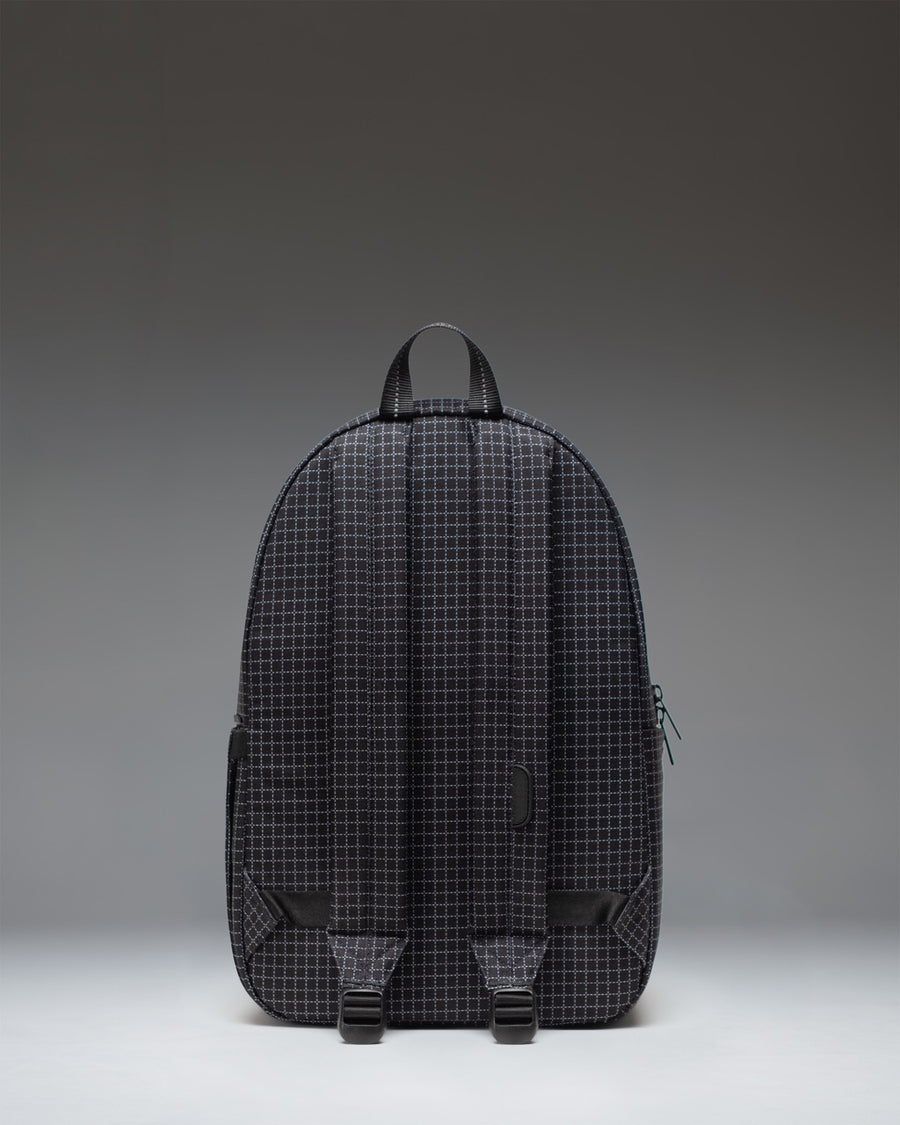 Herschel Supply Co. Settlement Backpack in Grid - Black featuring a classic design with a front pocket and exposed zippers.