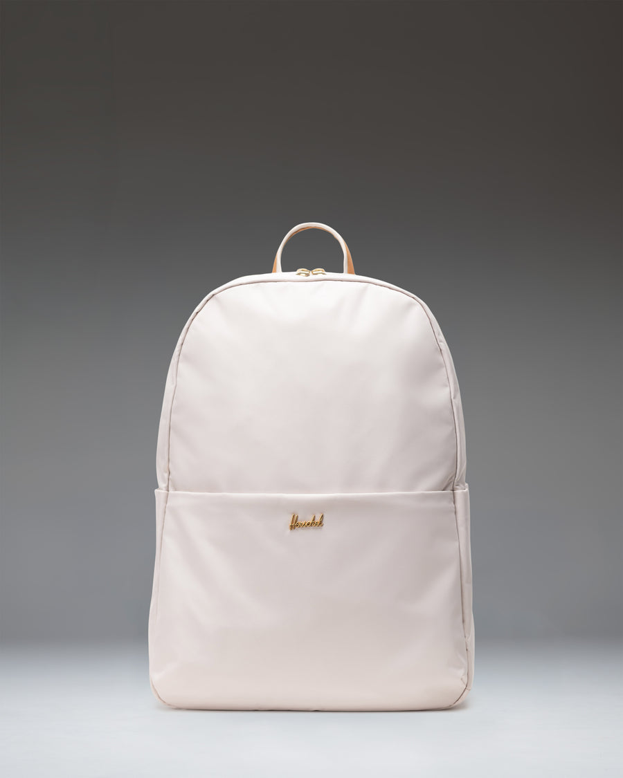 Herschel Supply Co. Beatrix Backpack in Moonbeam, front view showing its clean, minimalist design and light beige color.