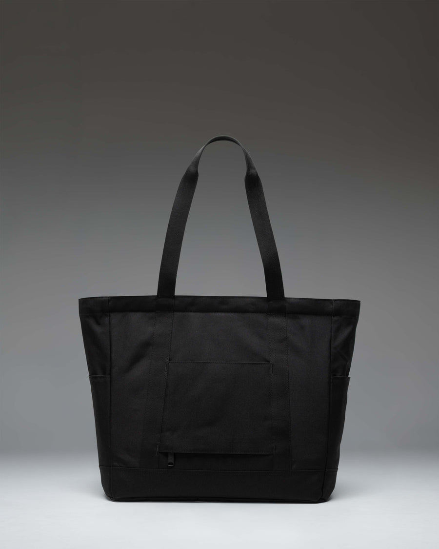 Herschel Heritage Tote bag in Black Tonal featuring classic design with dual top handles and a front zippered storage pocket.