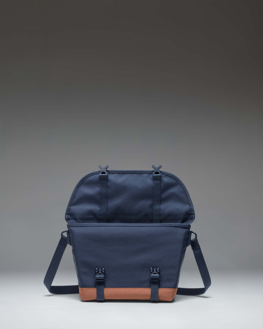 Herschel Supply Co. Cove Small Messenger bag in Navy and Saddle Brown, showing the front view with buckle closures.