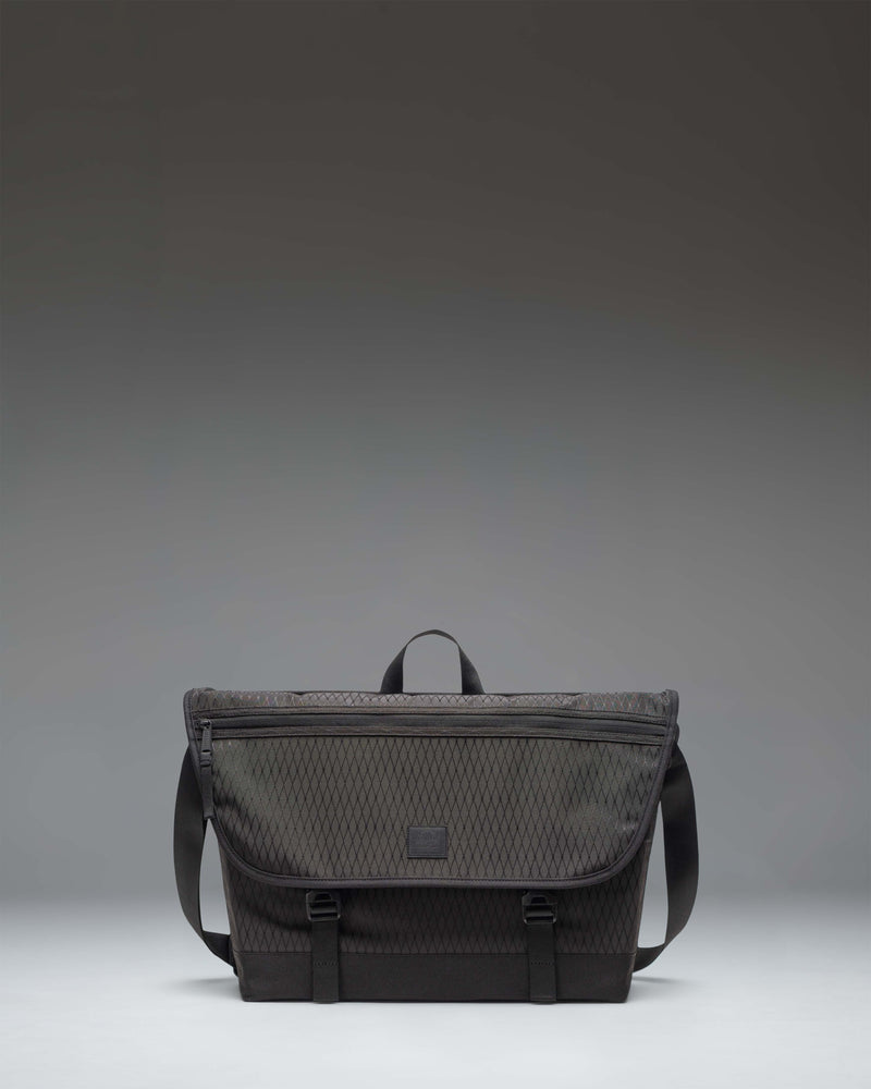 Herschel Supply Co. Cove Messenger bag in Black Diamond/Black, showing the clean, durable front design and adjustable shoulder strap.