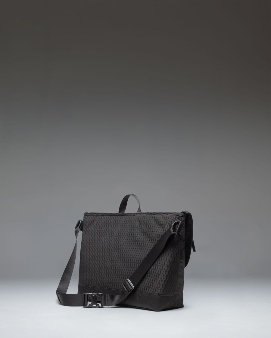 Herschel Supply Co. Cove Messenger bag in Black Diamond/Black.