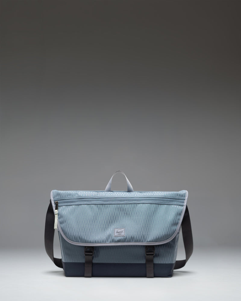 Herschel Supply Co Cove Messenger bag in Blue Mirage Diamond/Sea Storm.