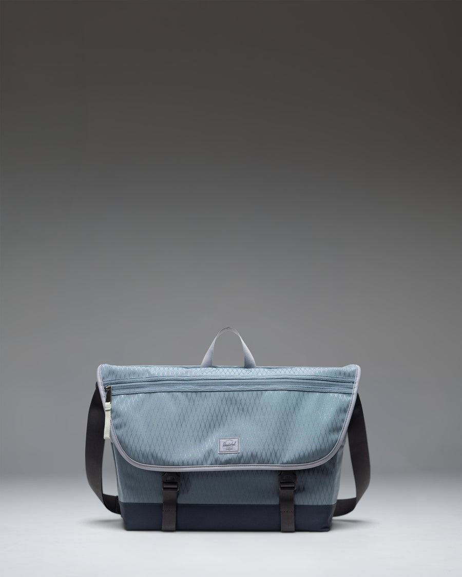 Herschel Supply Co Cove Messenger bag in Blue Mirage Diamond/Sea Storm.