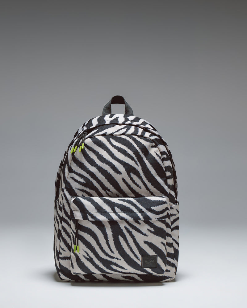 Herschel Classic Backpack in a bold black and white zebra print pattern, showcasing its simple design and clean aesthetic.