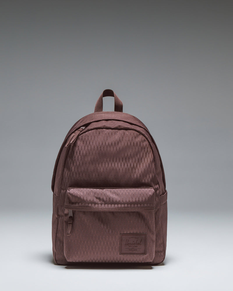 Herschel Classic Backpack in Huckleberry Diamond, featuring a purple diamond pattern with a front pocket and classic logo.