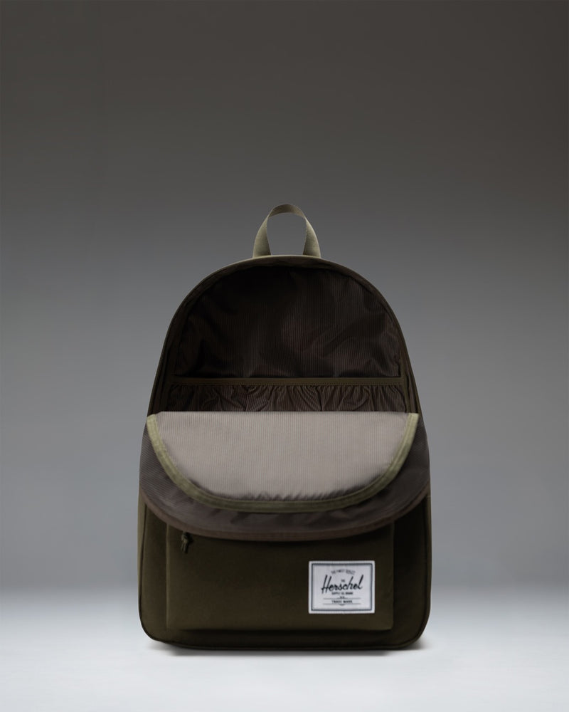 Herschel Supply Co. Classic XL Backpack in Ivy Green, showcasing its durable design, spacious main compartment, and comfortable padded straps.