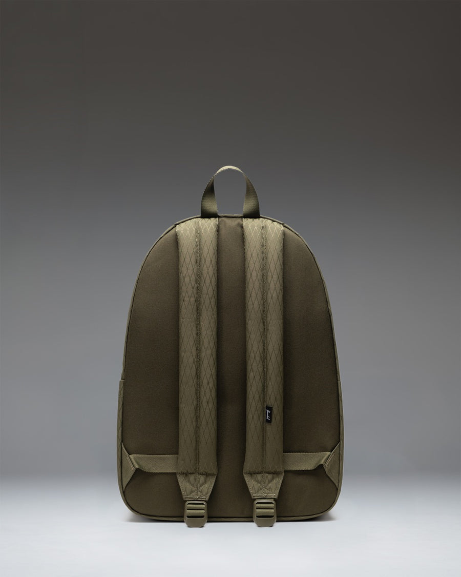 Herschel Classic XL Backpack in Ivy Green Diamond showing a close-up of the front storage pocket, key clip, and zipper detail.