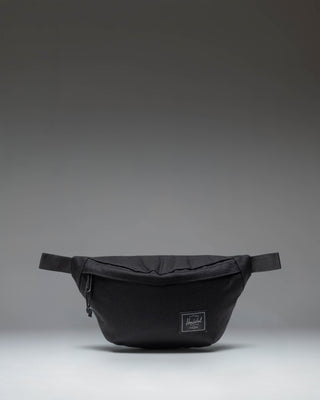 Herschel Classic Hip Pack in Black Tonal fabric, showing the front view with zipper closure and brand logo.