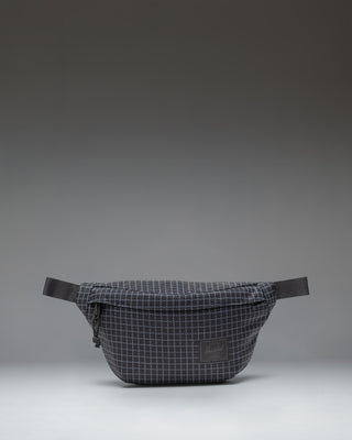 Herschel Classic Hip Pack in Grid Black/Black, showing the clean design and adjustable strap of the compact waist bag.