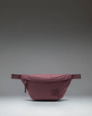 Herschel Supply Co. Herschel Classic Hip Pack in Huckleberry Diamond, a purple waist bag with a front pocket and adjustable strap.