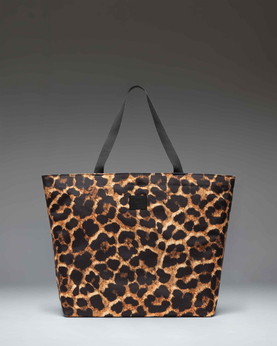 Herschel Supply Co. Classic Tote in Digi Leopard Light print, showcasing a spacious design with carrying handles.