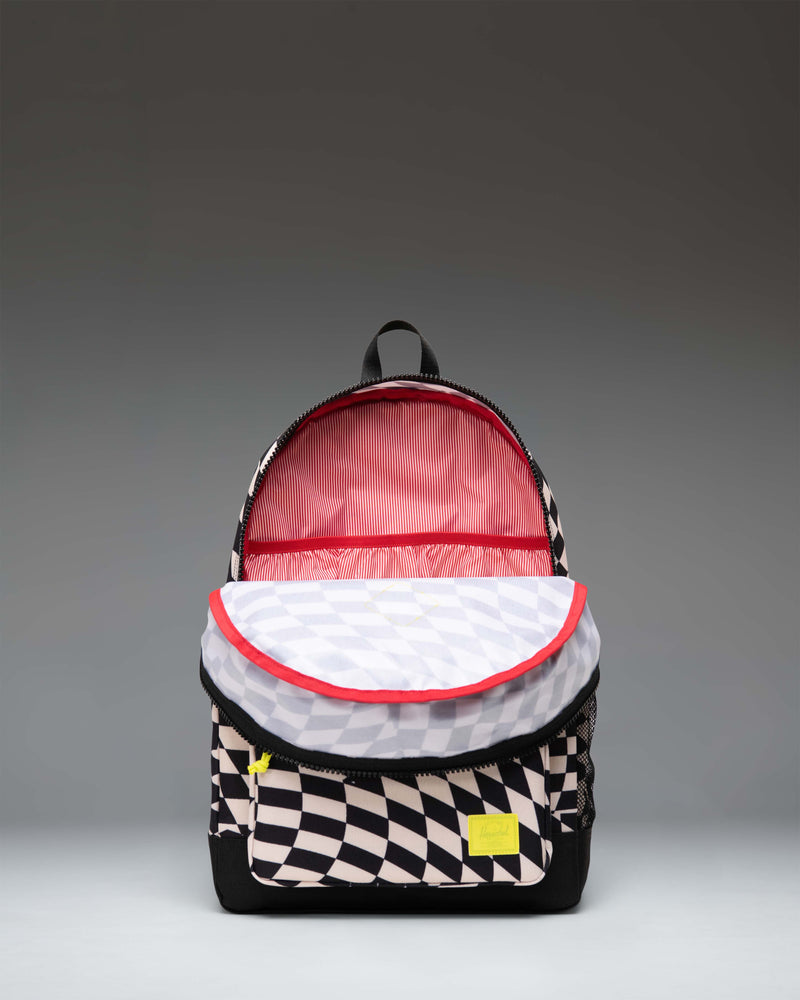 Herschel Heritage Youth Backpack in Warp Check checkered pattern, showing the classic school backpack design with a front pocket.