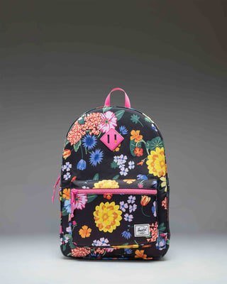 Herschel Supply Co. Herschel Heritage Youth Backpack in the Paper Garden floral print pattern, featuring a front pocket and classic diamond accent.