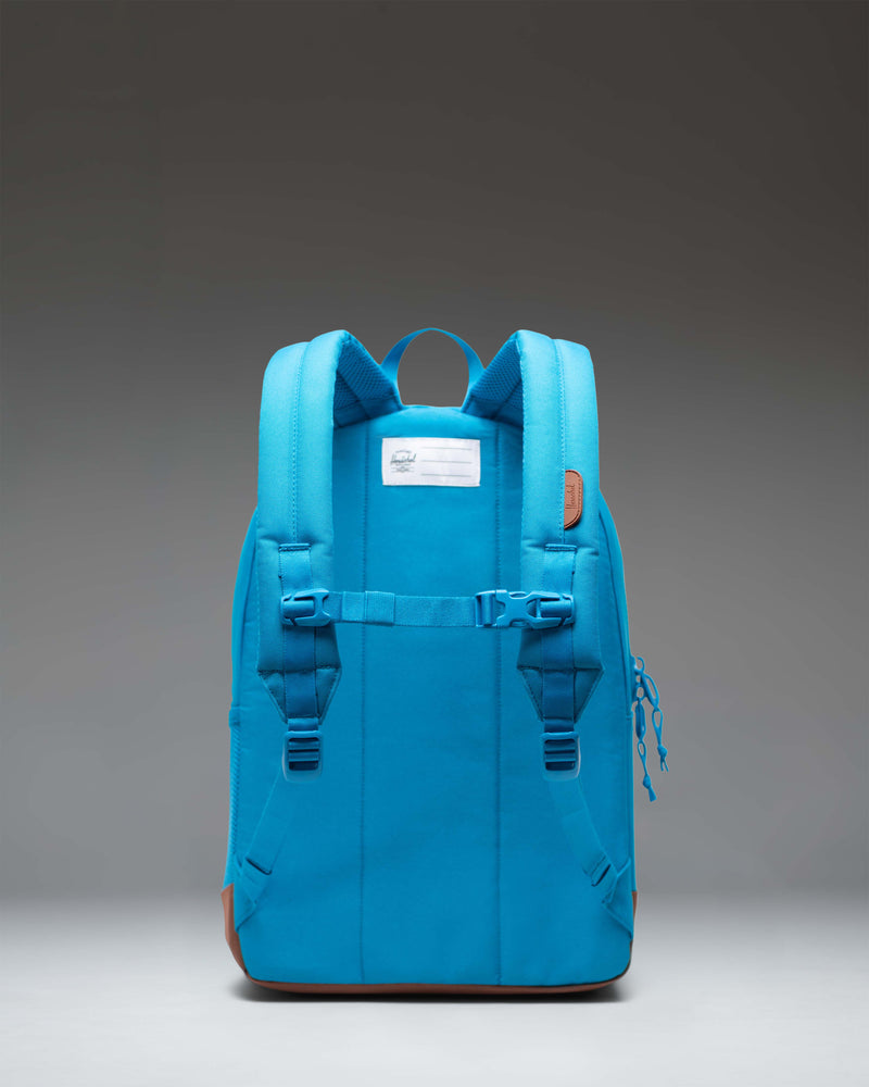 Herschel Heritage Youth Backpack in Hawaiian Surf turquoise and Saddle Brown with a front pocket and signature diamond detail.