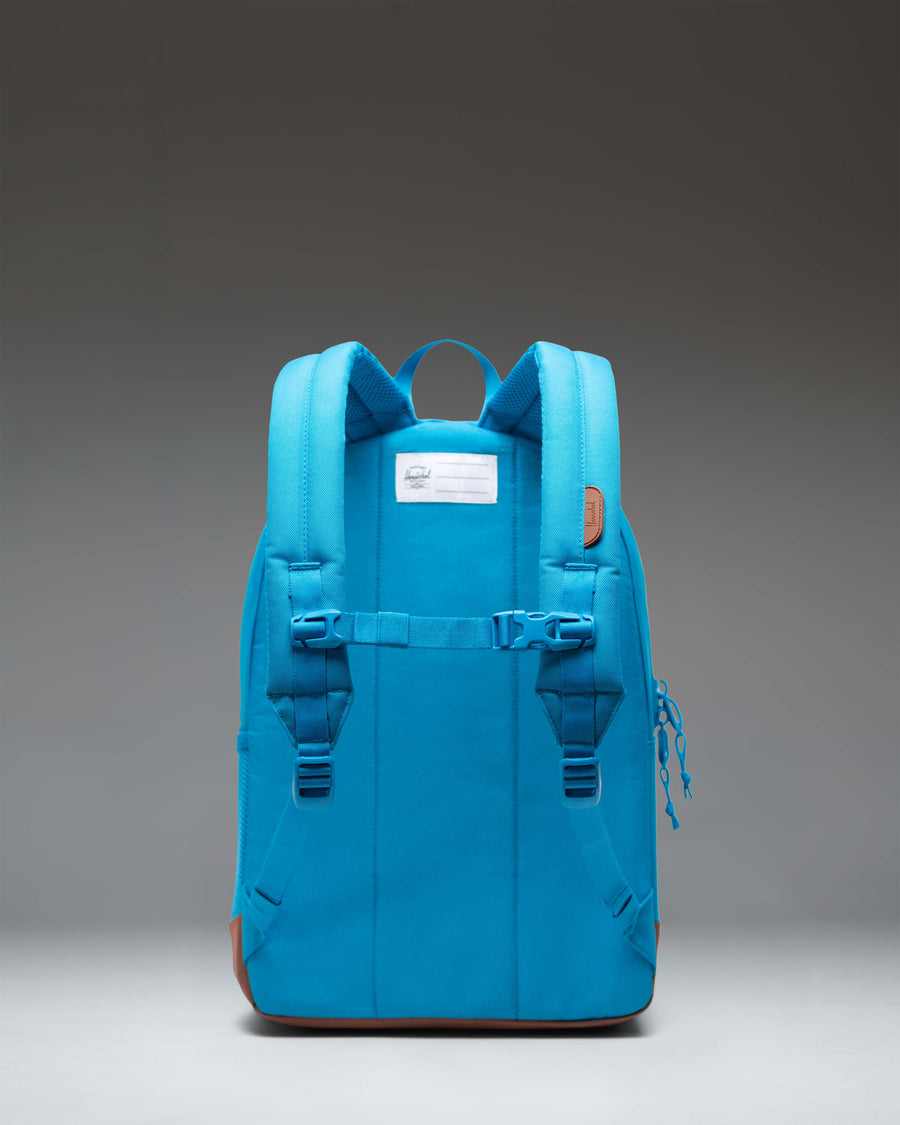 Herschel Heritage Youth Backpack in Hawaiian Surf turquoise and Saddle Brown with a front pocket and signature diamond detail.