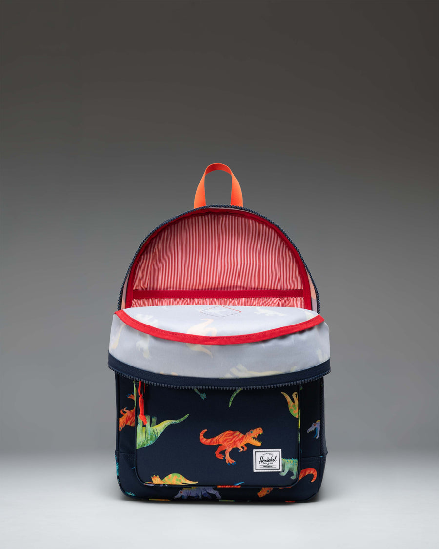 Herschel Heritage Youth Backpack in Water Colour Dinosaurs Darkest Navy, featuring a colorful dinosaur pattern on a dark navy blue background.