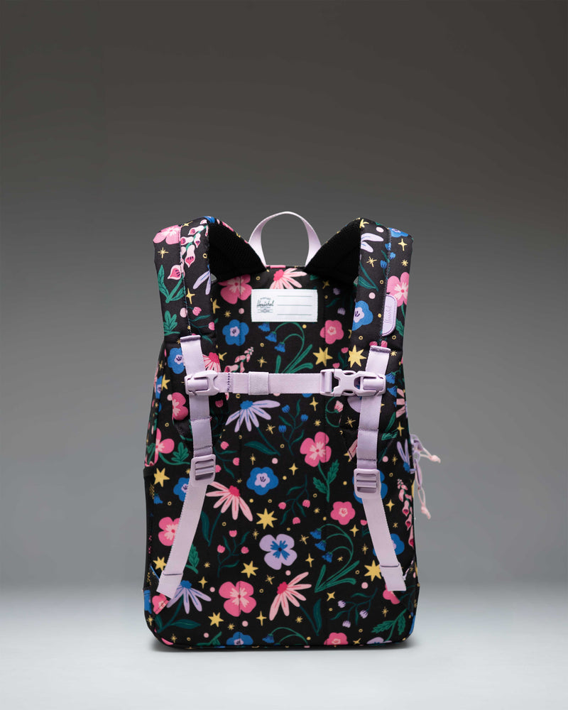 Herschel Heritage Youth Backpack in the Enchanted Garden floral print featuring a spacious main compartment, front pocket, and padded shoulder straps.