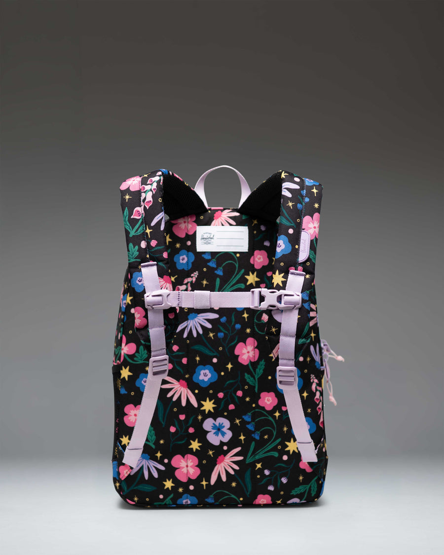 Herschel Heritage Youth Backpack in the Enchanted Garden floral print featuring a spacious main compartment, front pocket, and padded shoulder straps.