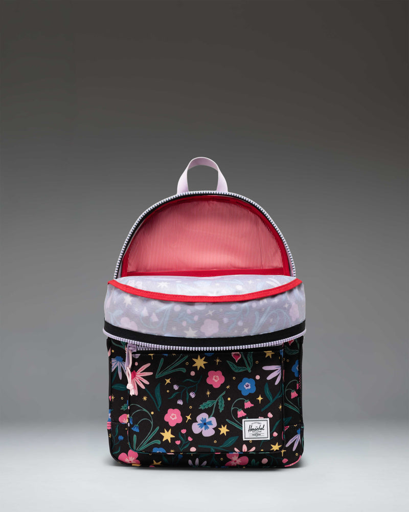 Herschel Heritage Youth Backpack in Enchanted Garden, featuring a vibrant floral pattern with a front pocket and classic diamond accent.