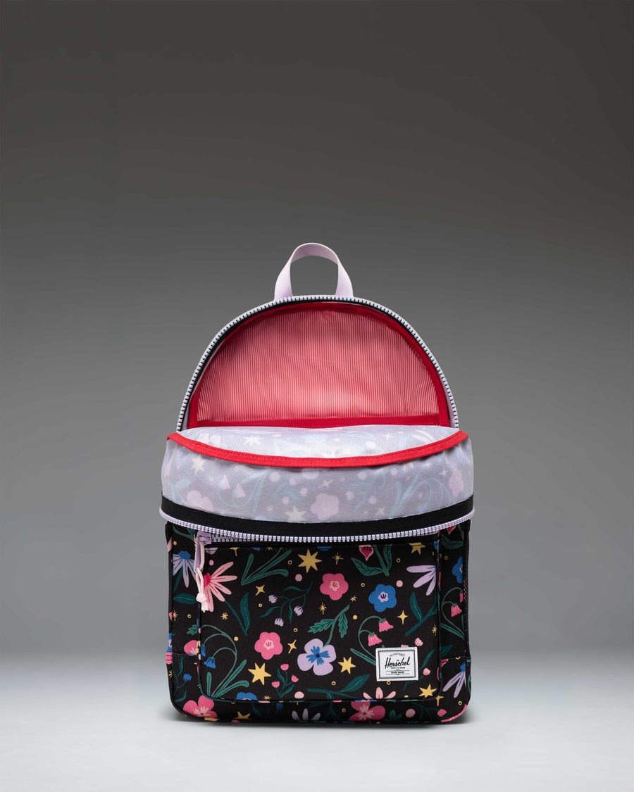 Herschel Heritage Youth Backpack in Enchanted Garden, featuring a vibrant floral pattern with a front pocket and classic diamond accent.