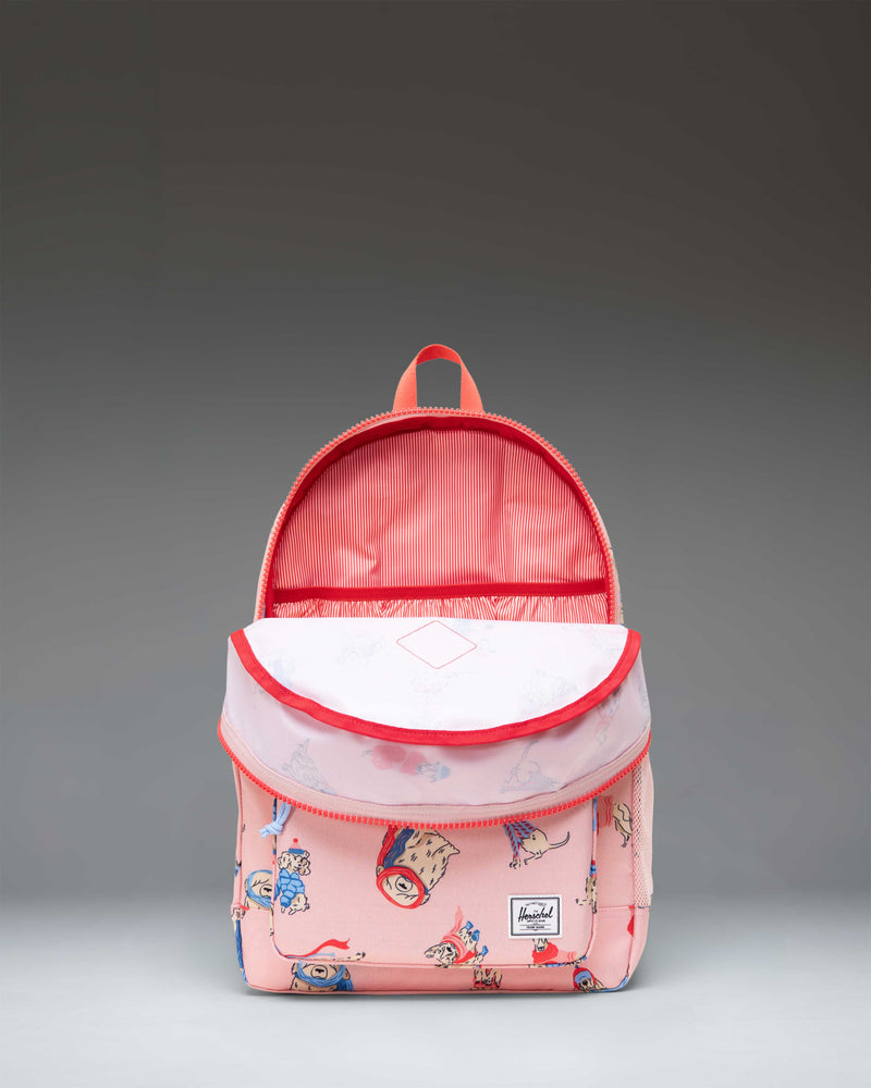 Herschel Heritage Youth Backpack in the Fashion Dogs pattern featuring various illustrated dogs on a light background.