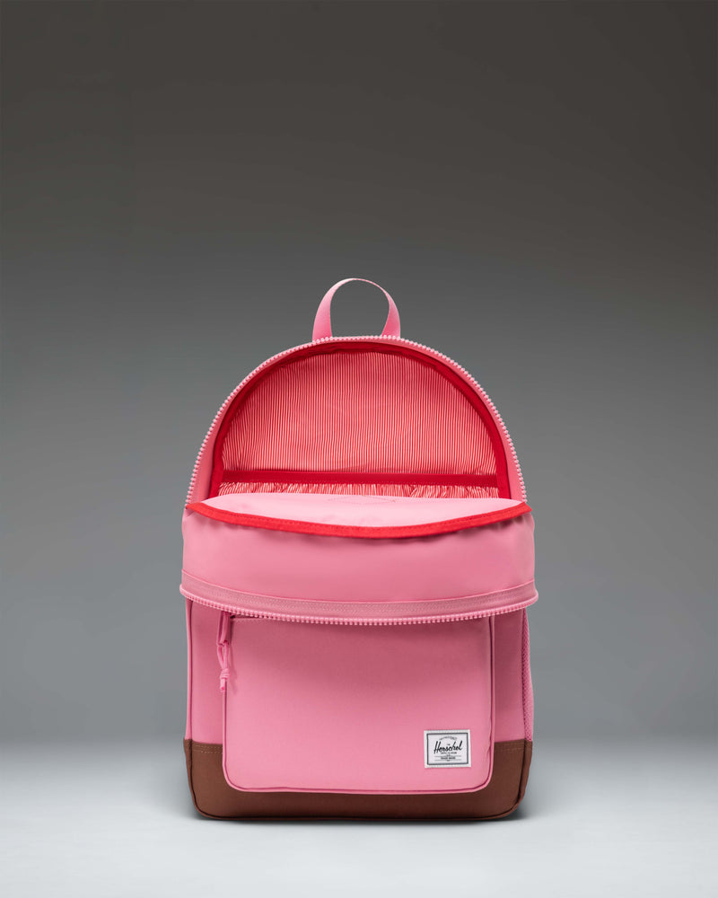 Herschel Heritage Youth Backpack in Cashmere Rose pink with a Saddle Brown diamond accent pocket and rubber diamond detail.