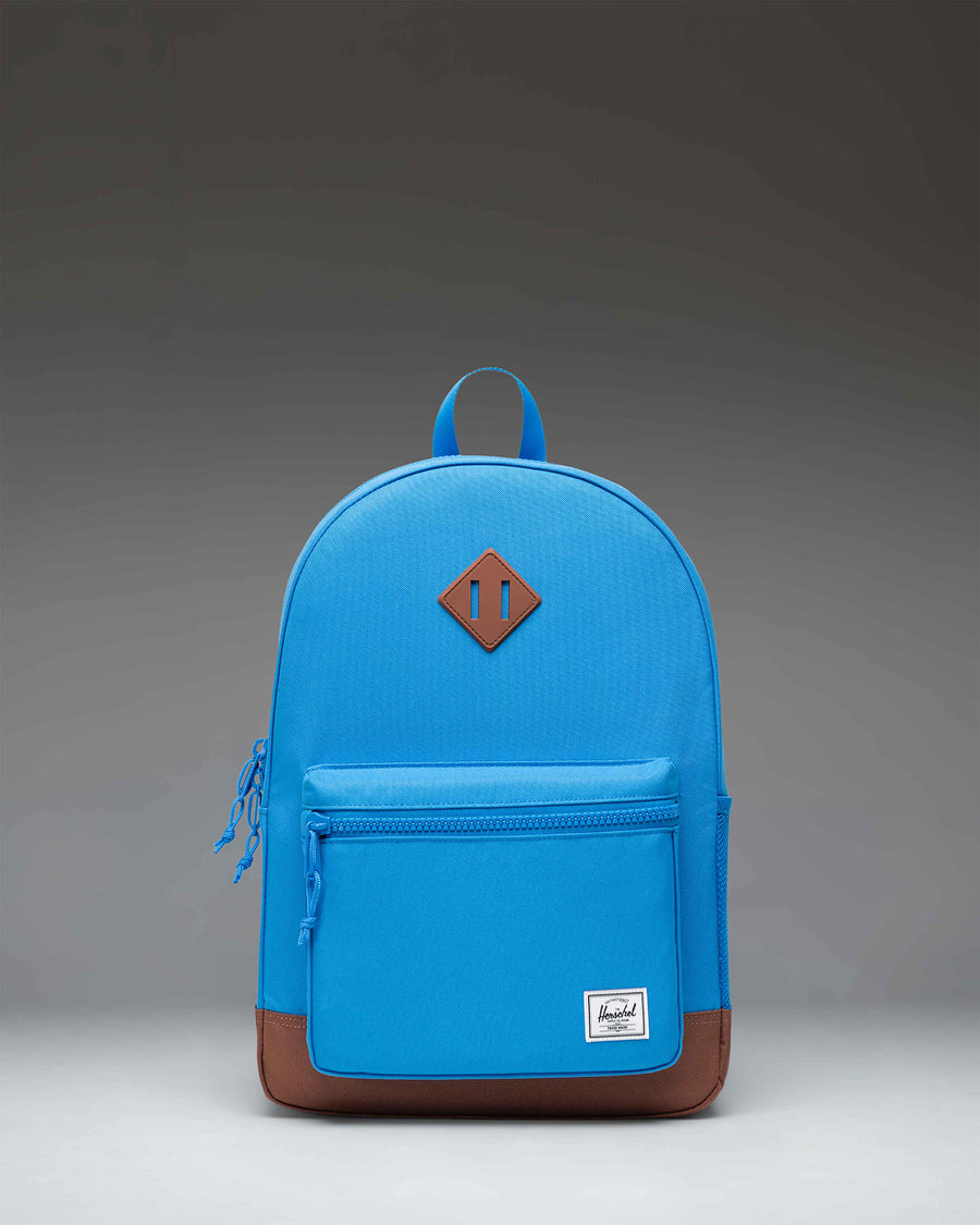Herschel Heritage Youth Backpack in French Blue with Saddle Brown details, featuring a front storage pocket.