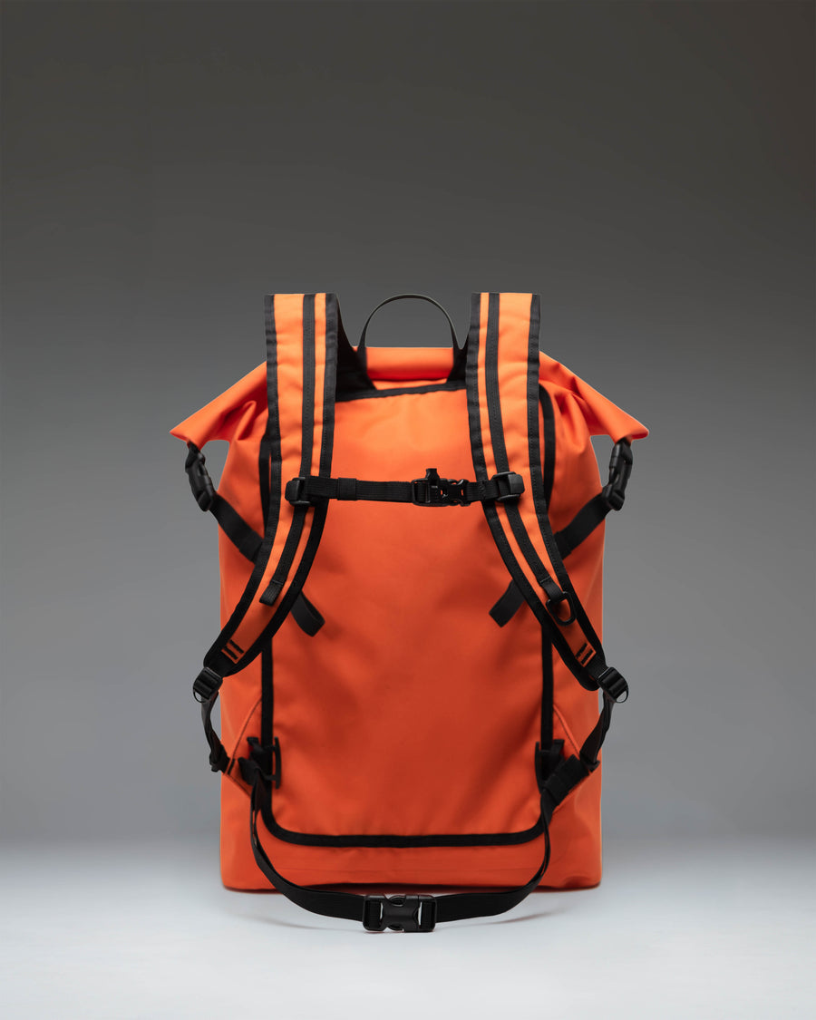 Herschel Supply Co. Dry Bag Backpack 32L in Vermillion Orange, a waterproof roll-top outdoor backpack.