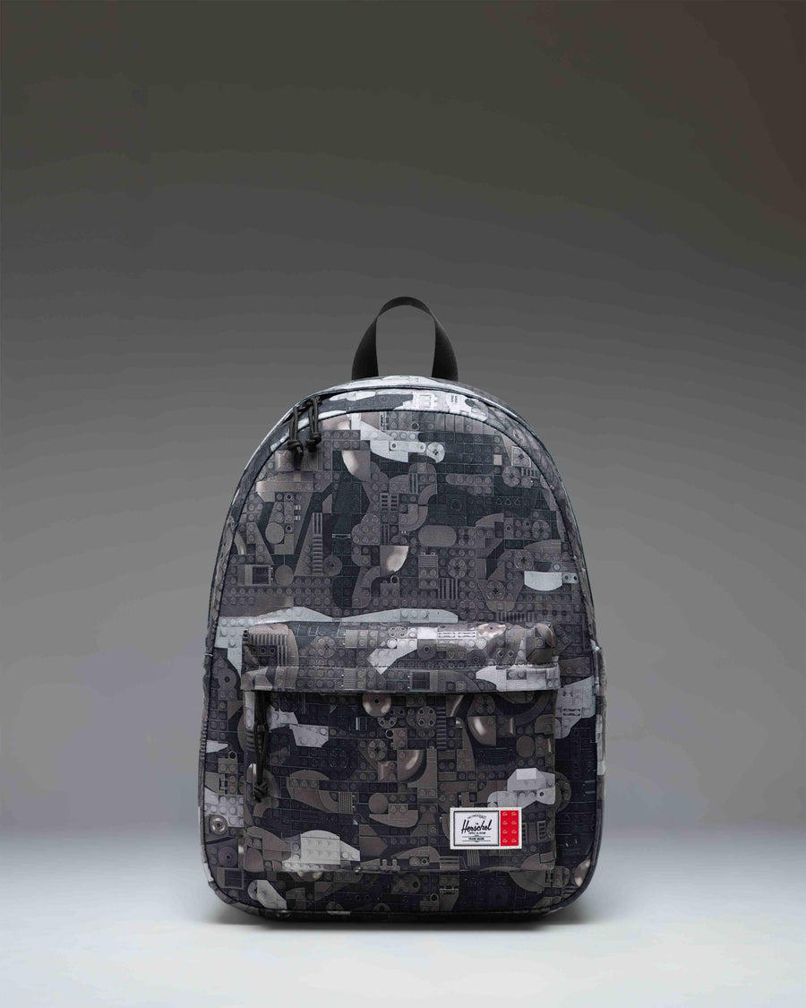 Herschel Supply Co. LEGO Classic Backpack in Abstract Bricks Black featuring a black body with a subtle tonal geometric brick pattern.