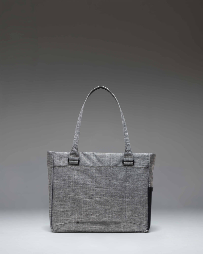 Herschel Supply Co. Kaslo Tote Tech bag in Raven Crosshatch grey fabric, showing the modern tote design ideal for tech storage and daily travel.