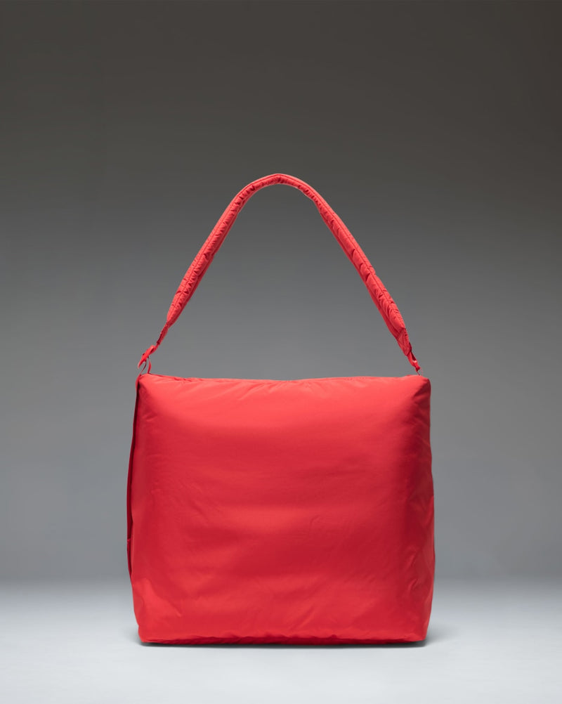 Herschel Supply Co. Cloudform Tote bag in Salsa red, featuring a minimalist padded design with dual carrying handles.