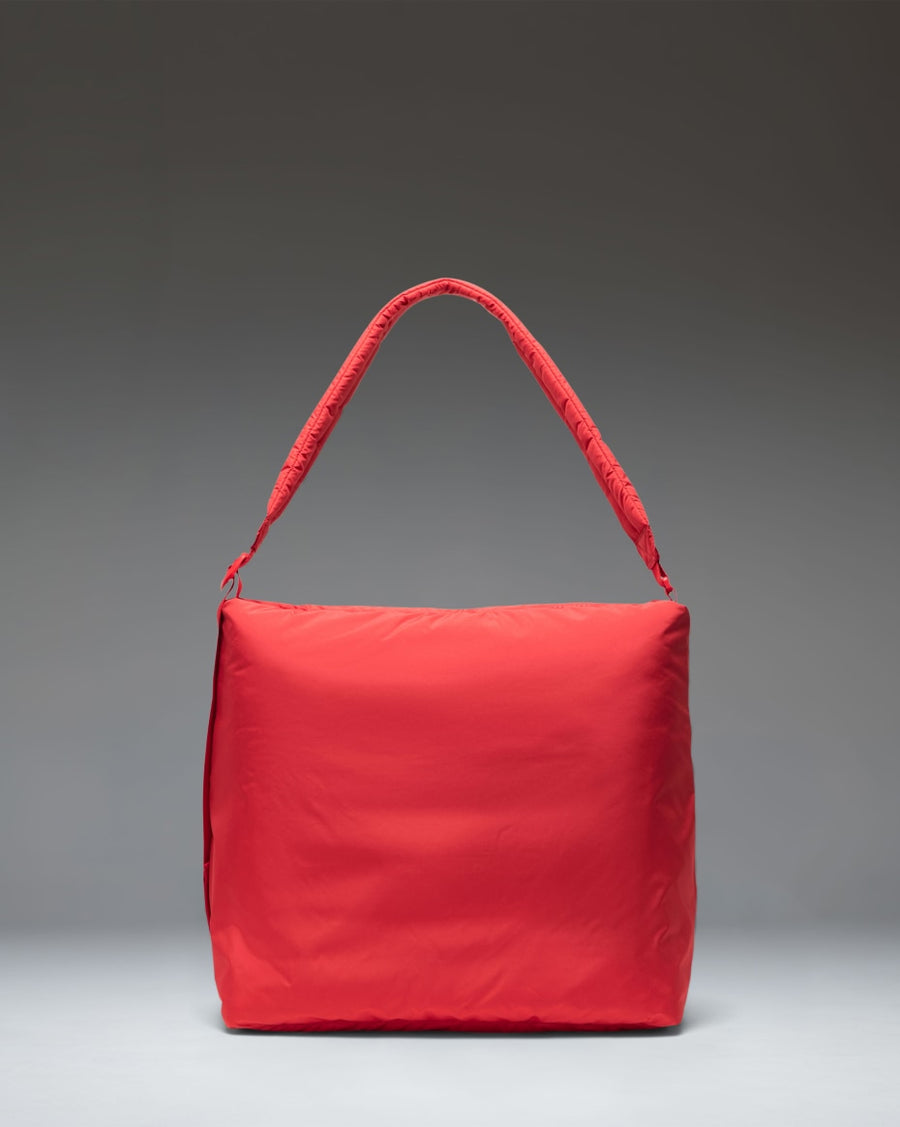 Herschel Supply Co. Cloudform Tote bag in Salsa red, featuring a minimalist padded design with dual carrying handles.