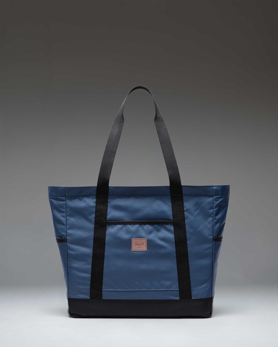 Herschel Heritage Tote bag in Oceana blue, featuring a classic design with dual carry handles and the signature Herschel woven label.