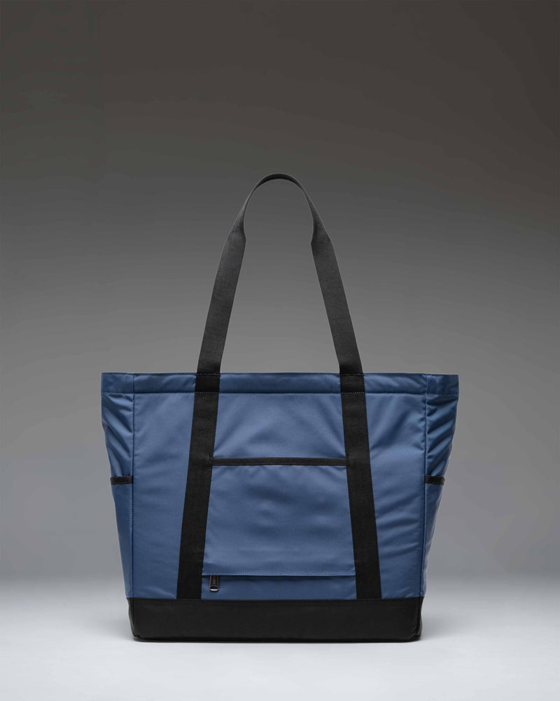 Herschel Heritage Tote bag in Oceana dark blue color featuring smooth webbing top handles and a classic silhouette.