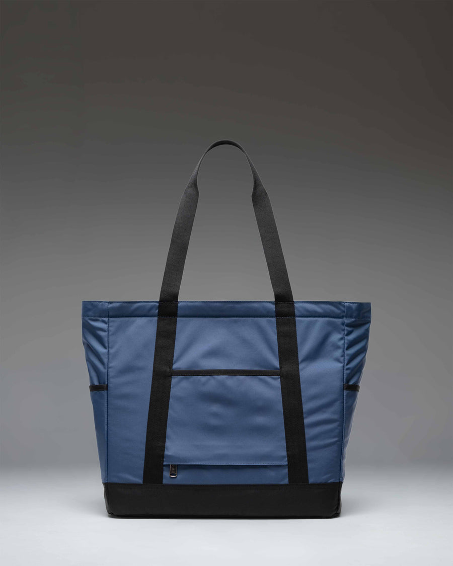 Herschel Heritage Tote bag in Oceana dark blue color featuring smooth webbing top handles and a classic silhouette.