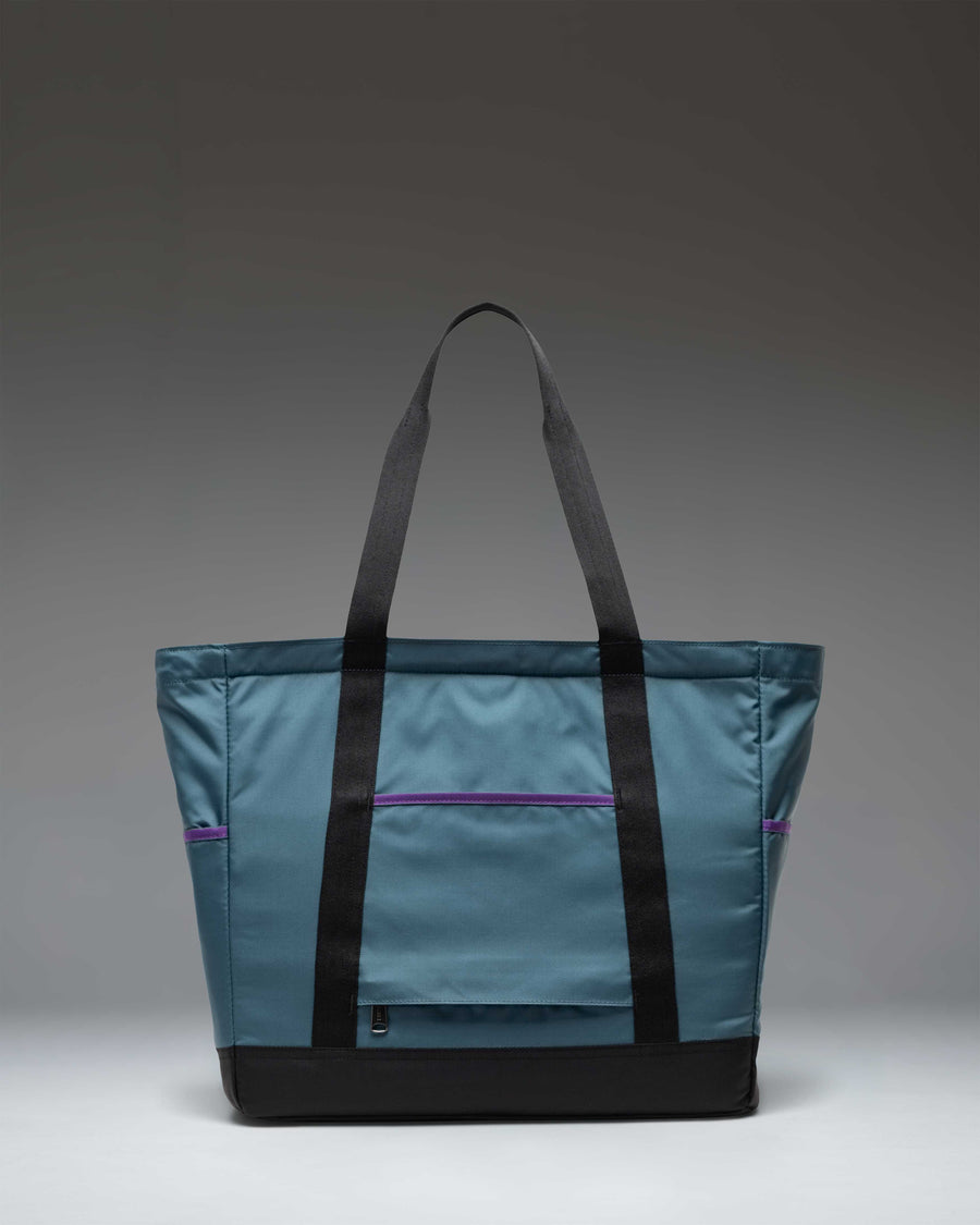 Herschel Supply Co. Heritage Tote in Mediterranea blue, showing the front view with the signature diamond detail and carrying handles.