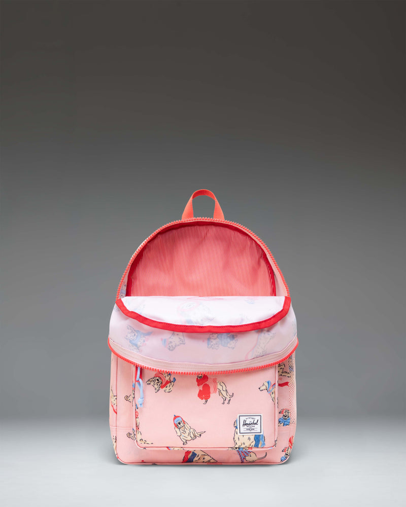 Herschel Heritage Kids Backpack in Fashion Dogs print, featuring a playful illustrated dog pattern with a front pocket and classic diamond accent.