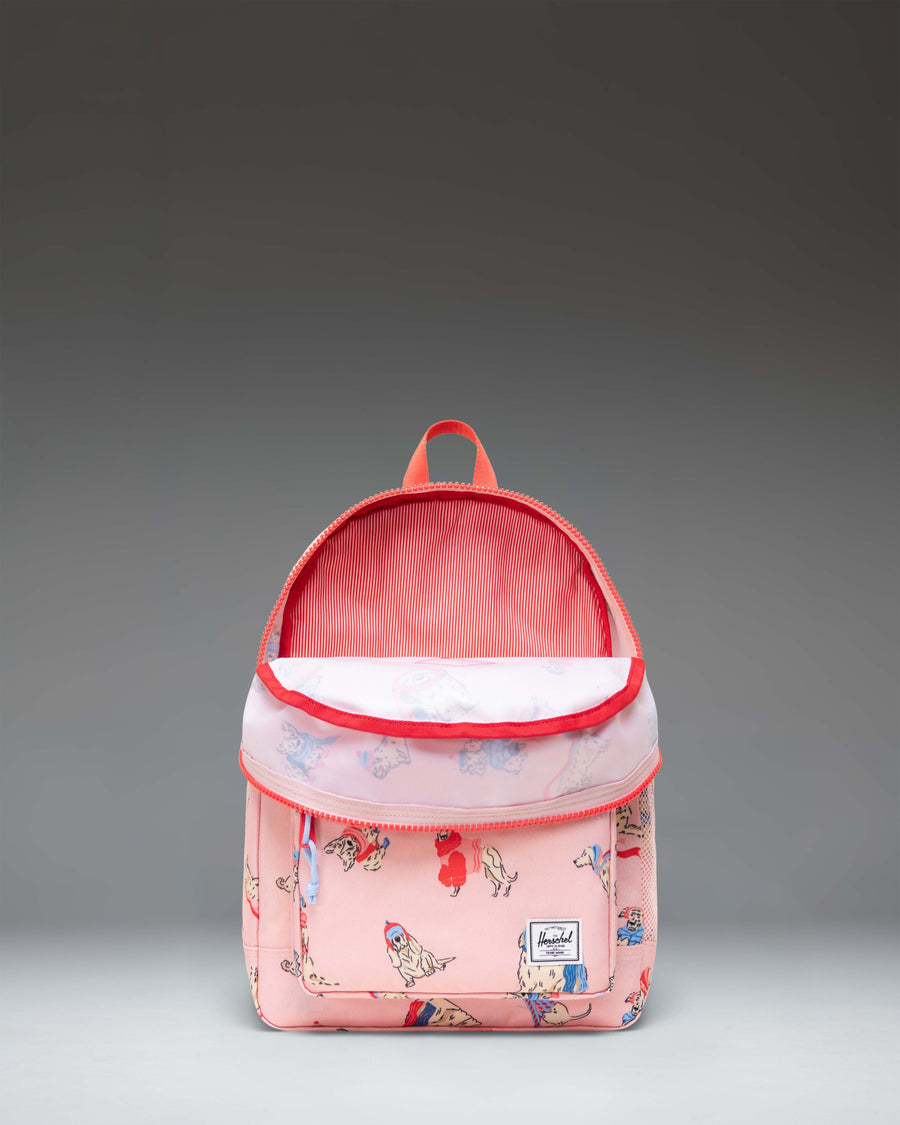 Herschel Heritage Kids Backpack in Fashion Dogs print, featuring a playful illustrated dog pattern with a front pocket and classic diamond accent.