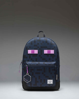 Herschel Supply Co. Minecraft Heritage Youth Backpack in Enderman black and purple with pixelated eye graphics.