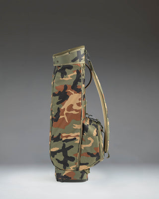 Herschel Watt Sunday Bag in Woodland Camo, a lightweight golf bag with a carrying strap and a stand.