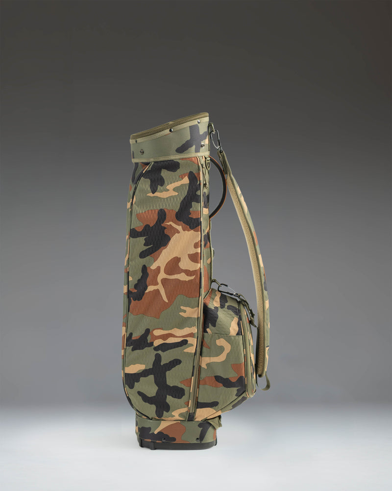 Herschel Watt Sunday Bag in Woodland Camo, a lightweight golf bag with a carrying strap and a stand.
