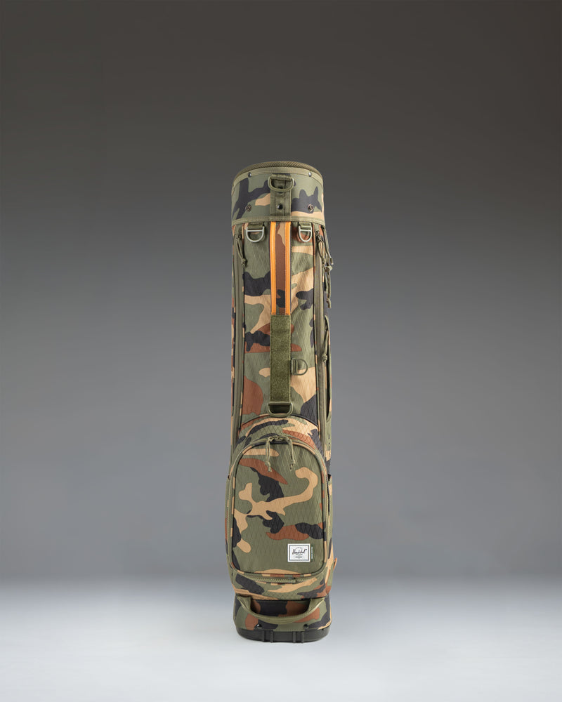 Herschel Watt Sunday Bag in Woodland Camo, lifestyle view of the lightweight golf bag showing its camouflage pattern.