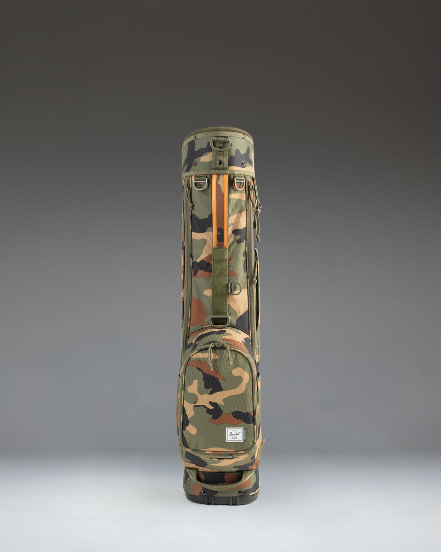 Herschel Watt Sunday Bag in Woodland Camo, lifestyle view of the lightweight golf bag showing its camouflage pattern.