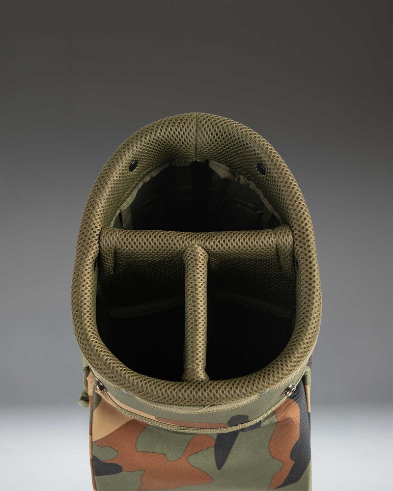Herschel Watt Sunday Bag in Woodland Camo, lifestyle view showing the golf bag's lightweight design and camouflage pattern.