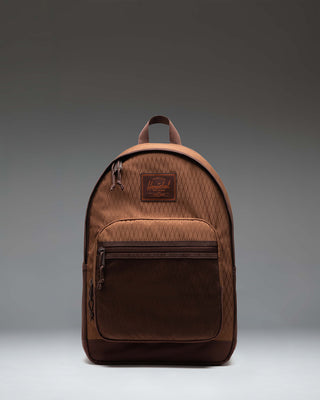 Herschel Supply Co. Kaine Backpack in Soft Silt Diamond/Chicory Coffee shown from the front, highlighting its multi-pocket design and utility straps.