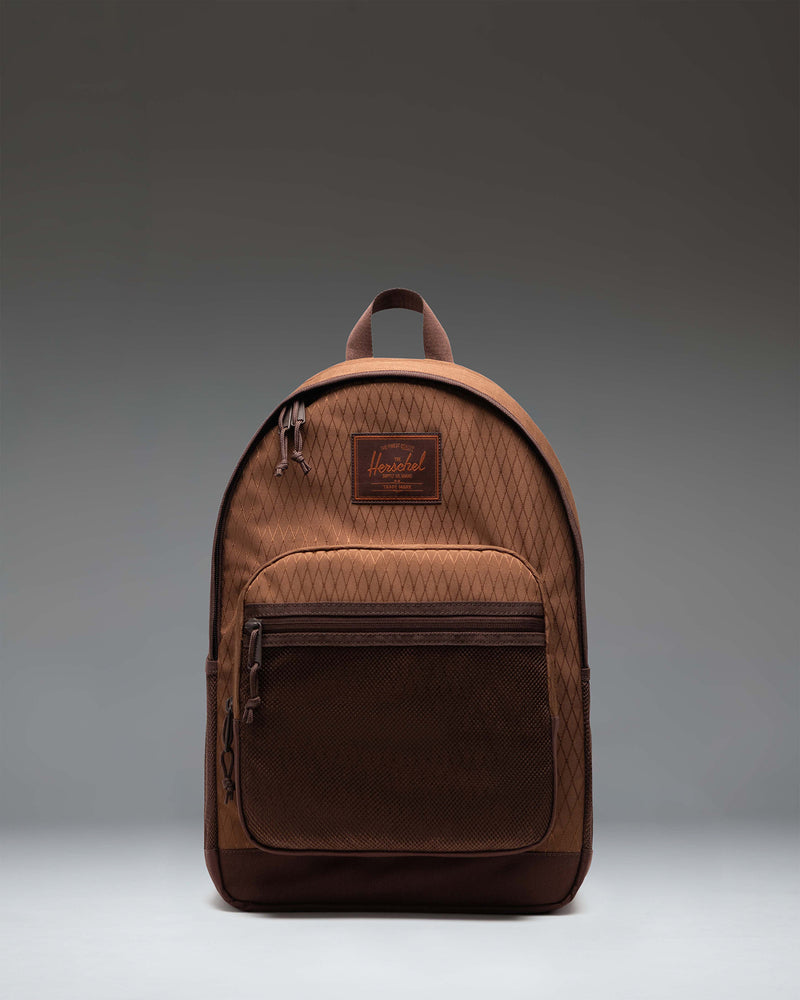 Herschel Supply Co. Kaine Backpack in Soft Silt Diamond/Chicory Coffee shown from the front, highlighting its multi-pocket design and utility straps.
