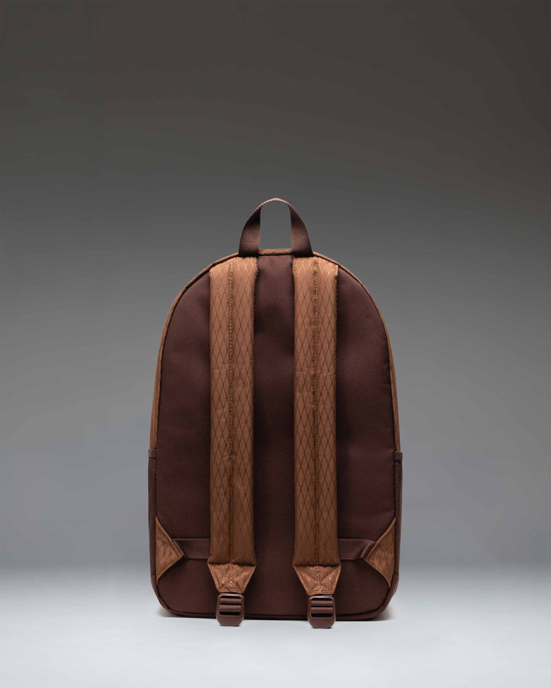 Herschel Supply Co. Kaine Backpack in Soft Silt Diamond and Chicory Coffee brown, showing the front view with pockets and straps.